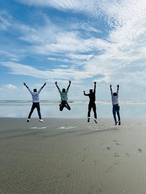Team celebrating financial freedom on beach